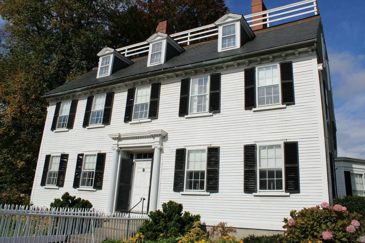 White colonial home with black shutters in Salem