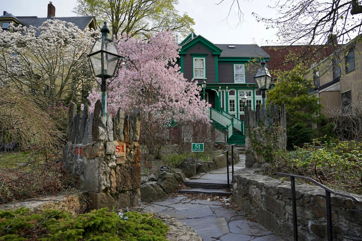 Historic Boston home framed by spring flowers