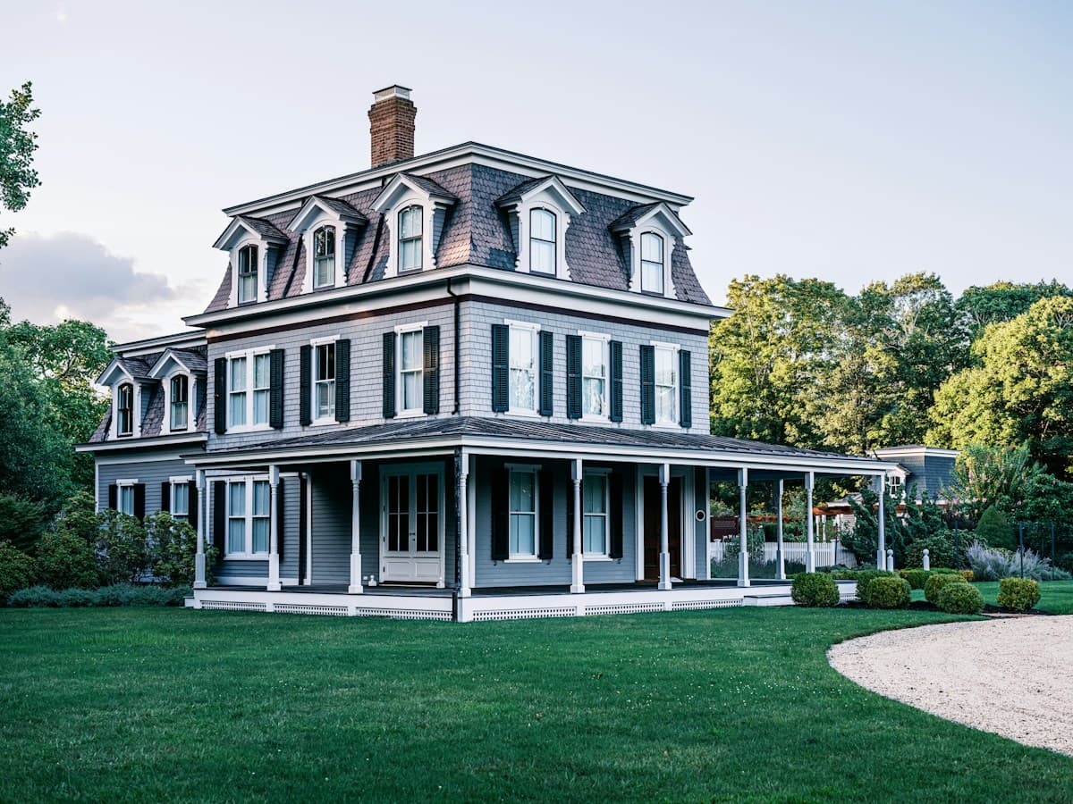 Gray Victorian home with a wraparound porch